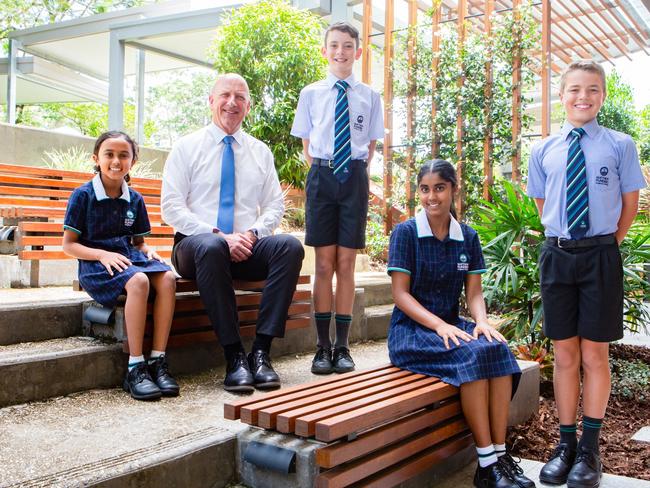 Matthew Flinders Anglican College had some outstanding Naplan results over the last five years. From left, Ayanna Afraz (Year 3), college principal Stuart Meade, Cade Hartley (Year 5), Nethra Chandrasekar (Year 9) and Xavier McFarlane (Year 7).