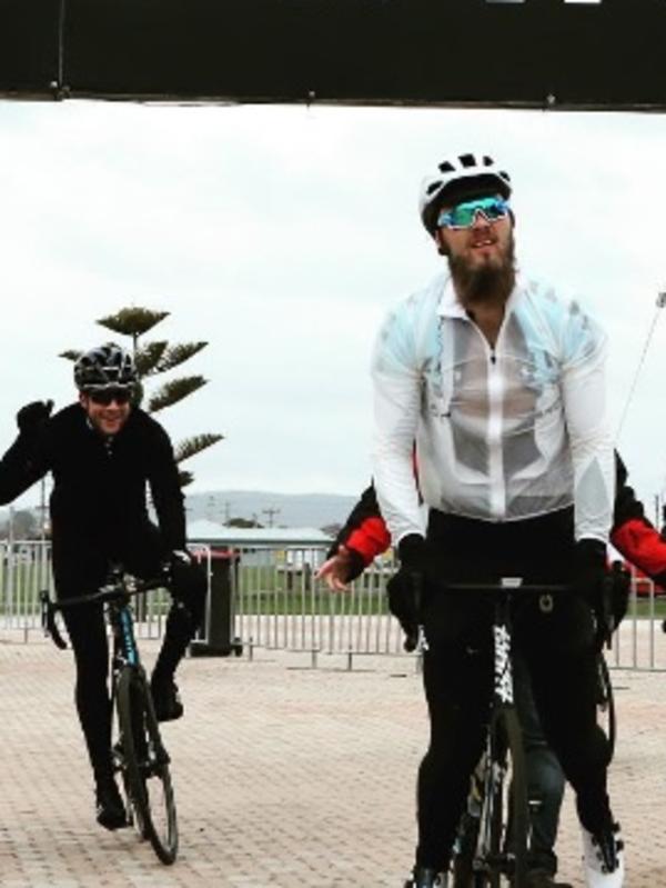 Max Gawn rides with Hamish Blake.