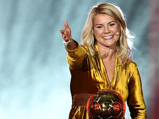 Olympique Lyonnais' Norwegian forward Ada Hegerberg gestures after receiving the 2018 FIFA Women's Ballon d'Or award for best player of the year during the 2018 FIFA Ballon d'Or award ceremony at the Grand Palais in Paris on December 3, 2018. - The winner of the 2018 Ballon d'Or will be revealed at a glittering ceremony in Paris on December 3 evening, with Croatia's Luka Modric and a host of French World Cup winners all hoping to finally end the 10-year duopoly of Cristiano Ronaldo and Lionel Messi. (Photo by FRANCK FIFE / AFP)