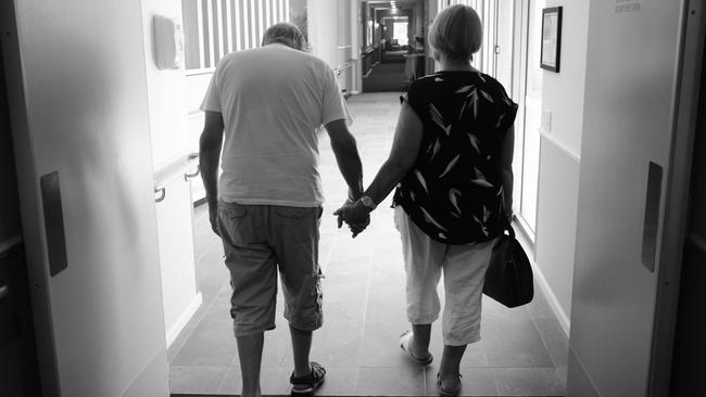 Cindy Ramage walks with her husband Joe, who has stage four dementia. Picture: Gary Ramage