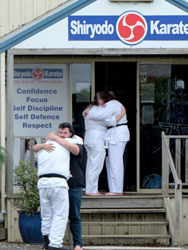 People consoling each other outside Shiryodo Karate after Malcolm Ayles, the owner and head instructor, drowned in Thailand. Picture: Mark Wilson