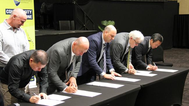 Regional Development, Manufacturing and Water Minister, Member for Gladstone Glenn Butcher oversees the signing of the memorandum of understanding for the Gladstone Hydrogen Ecosystem project by (l to r) Gladstone Mayor Matt Burnett, Gladstone Ports Corporation acting Chief Executive Craig Walker, Australian Gas Infrastructure Group Executive General Manager Craig de Laine, CQ University Vice President Global Development Alastair Dawson and Sumitomo Corporation Australia Managing Director Yoshikazu 'Cash' Ishikawa in Gladstone on March 17, 2021. Picture: Rodney Stevens