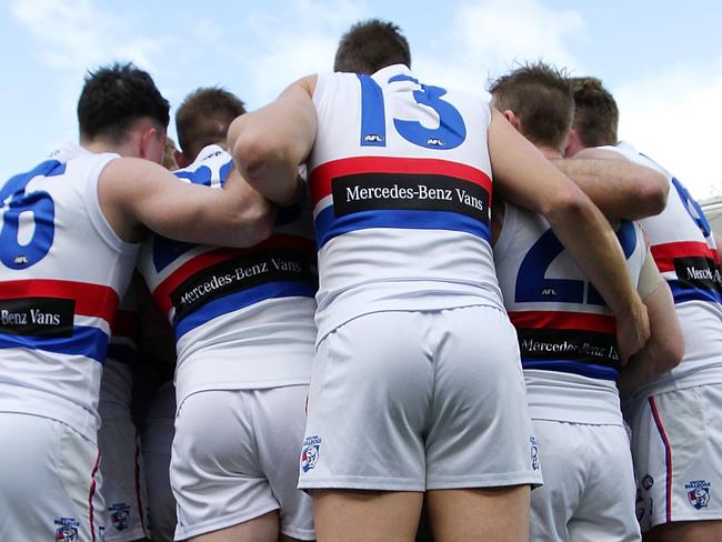 PERTH, WESTERN AUSTRALIA - JULY 22:  The Bulldogs huddle during the round 18 AFL match between the West Coast Eagles and the Western Bulldogs at Optus Stadium on July 22, 2018 in Perth, Australia.  (Photo by Will Russell/AFL Media/Getty Images)