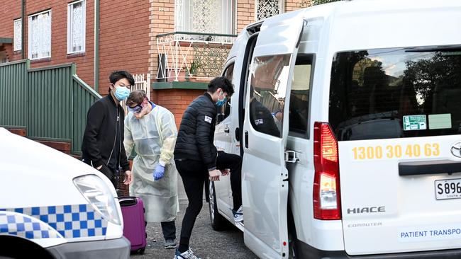 Two residents are escorted and transported to hospital after the apartment building is locked down after being confirmed as a tier 1 exposure site in Hill Street, Campsie in Sydney's west. Picture: NCA NewsWire / Jeremy Piper