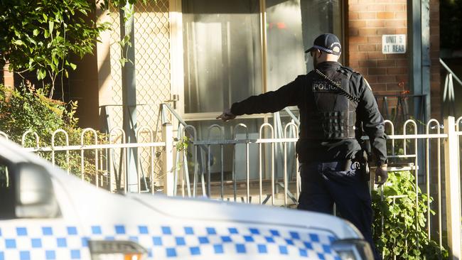 Police and forensic teams set up crime scene where a mans body was discovered in an apartment in Auburn. Picture: NewsWire / Jeremy Piper