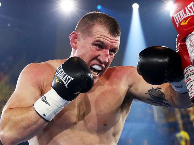 WOLLONGONG, AUSTRALIA - APRIL 21: Paul Gallen punches Lucas Browne during their bout at WIN Entertainment Centre on April 21, 2021 in Wollongong, Australia. (Photo by Mark Metcalfe/Getty Images)