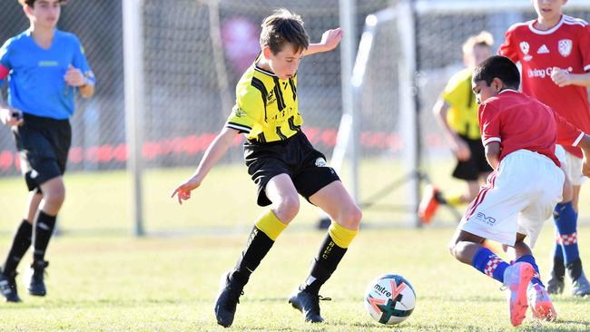 SOCCER: Junior football carnival, Maroochydore. Gold Coast Knights (red) V Moreton Bay United, boys. Picture: Patrick Woods.