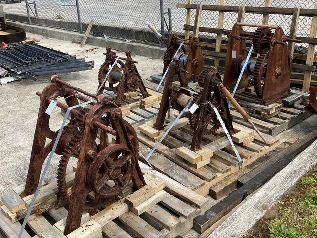 Some of the 12 historic boat winches at a facility in Brookvale where they have been sent from Fishermans Beach at Collaroy to be restored. Picture: Michell Cudmore