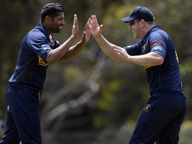 StrathmoreÃs Johnny Bassi, right celebrates after taking a catch during VSDCA cricket match between Strathmore and Box Hill in Strathmore, Saturday, Nov. 20, 2021. Picture: Andy Brownbill