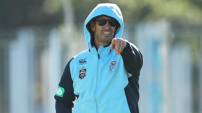 Andrew Johns doing his best to avoid Reg during Blues training. (Phil Hillyard)