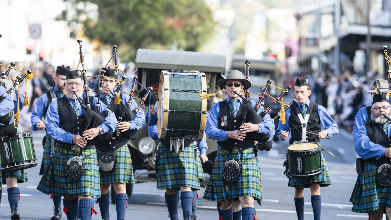 Toowoomba Caledonian Pipe Band march to the Mothers' Memorial for the mid-morning Toowoomba Anzac Day service, Tuesday, April 25, 2023. Picture: Kevin Farmer