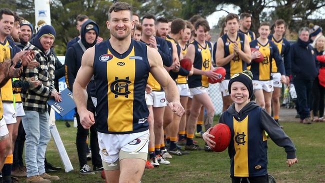 Daniel Keenan runs out for his 400th game. Picture: Hamish Blair