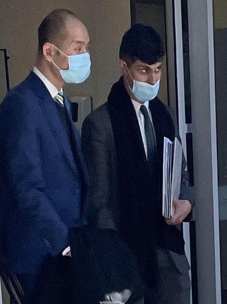 Lu (left) leaves court on Tuesday.