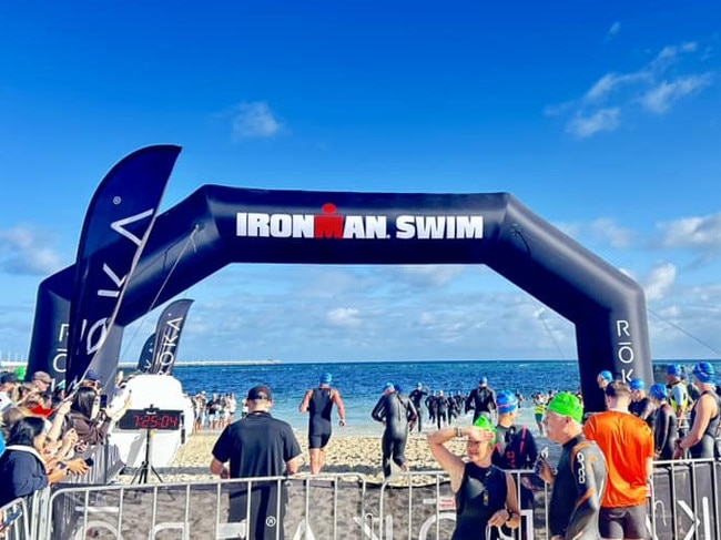 An athlete has died after being pulled from choppy waters during a gruelling Ironman triathlon in WA.