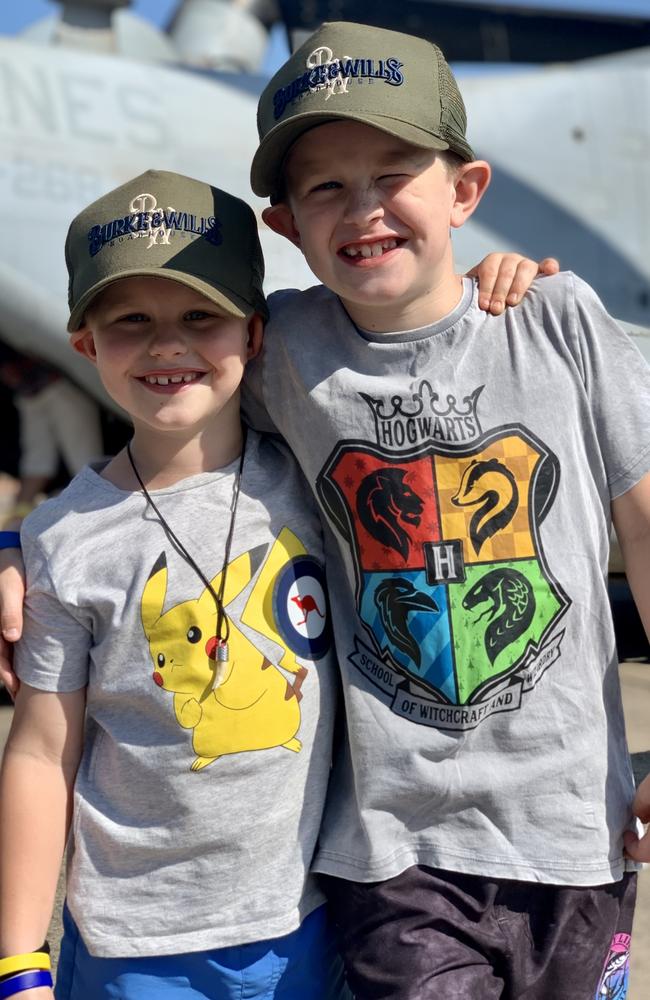 Brothers Deacon Pallot, 6, and Clayton Pallot, 8, at the Pitch Black Open Day at RAAF Darwin. Saturday, August 27, 2022. Picture: Tara Miko