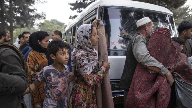 Displaced familes are moved to shelter in Kabul on Thursday. Picture: Getty Images