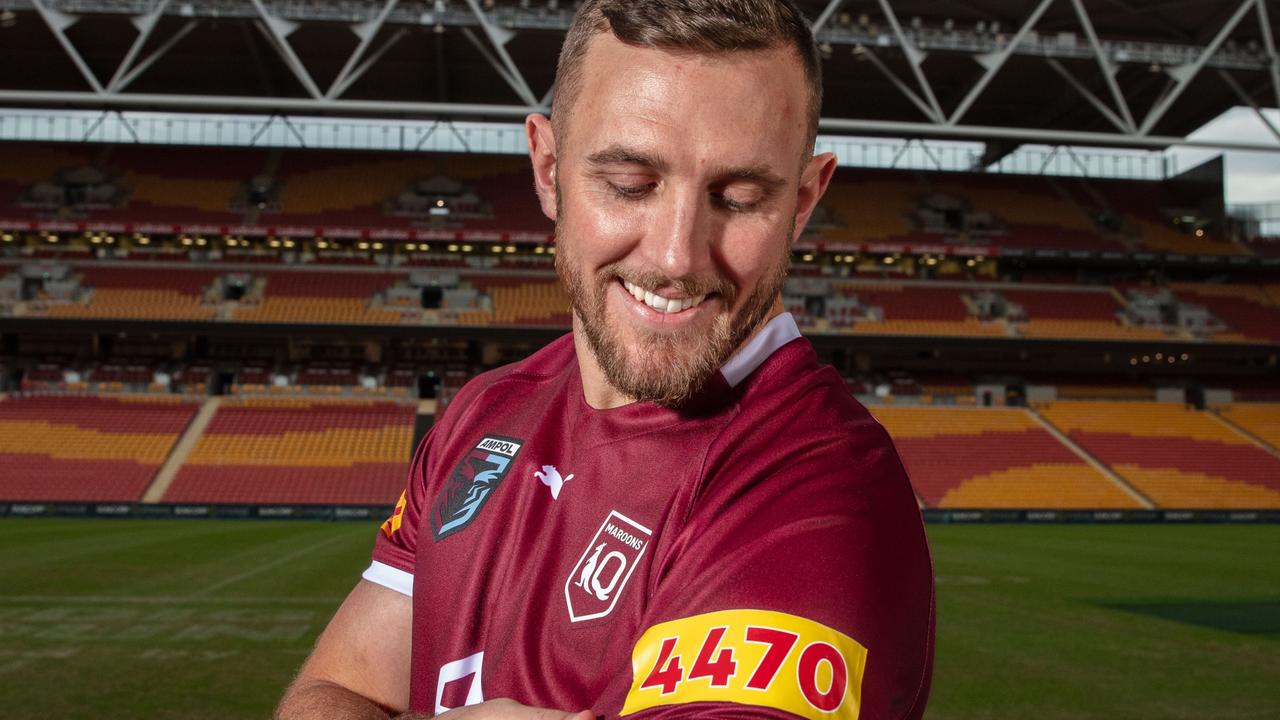 Charleville junior Kurt Capewell admires the 'new' Queensland Maroons jersey, with sponsor XXXX is giving up its 2022 branding by replacing with the home postcodes of the players.