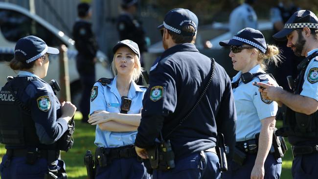 Dozens of police are positioned around The Domain at the protest. Picture: David Swift