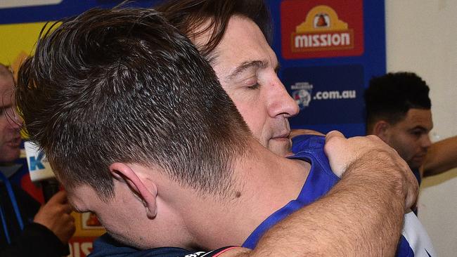 Clay Smith and Luke Beveridge embrace after Friday night’s win. Picture: Getty Images.