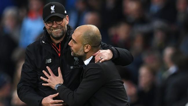 Even Jurgen and Pep are excited about this. (AFP Photo / Paul Ellis)