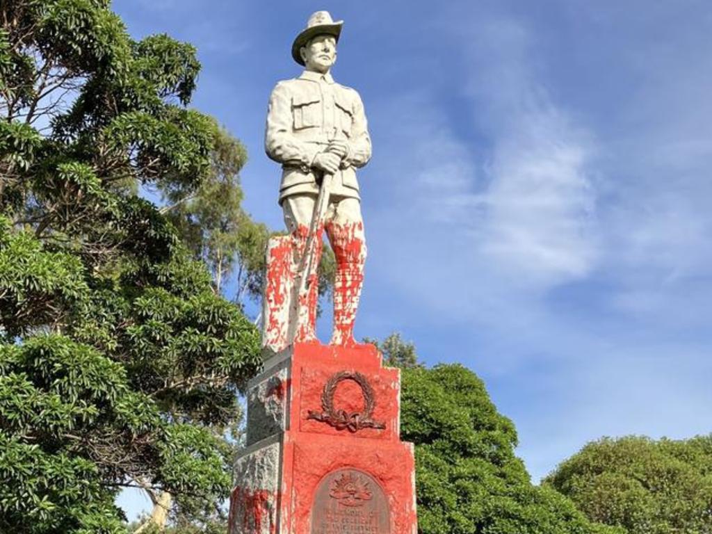 An Anzac memorial in Parkville honouring soldiers who died fighting in World War One was doused with red paint and defaced with the words ‘land back’ and ‘the colony will fall’. Picture: Bev Noonan