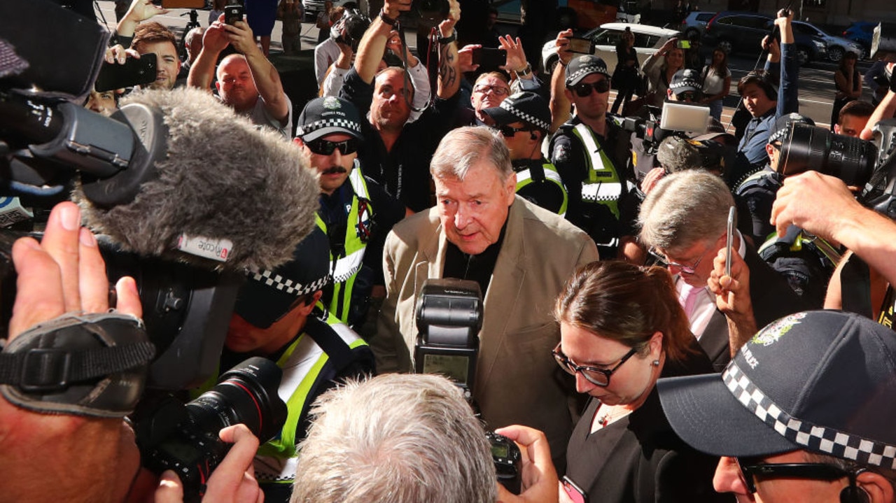 George Pell was surrounded by police as he arrived at Melbourne County Court in 2019. Picture: Michael Dodge/Getty Images