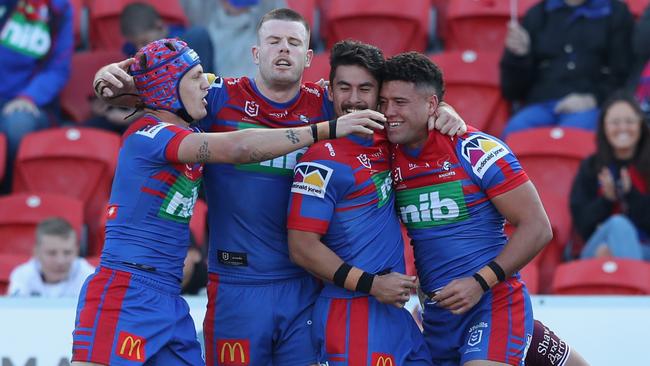 The Newcastle Knights celebrate a try during the Round 14 NRL match between the Newcastle Knights and the Manly Sea Eagles at McDonald Jones Stadium.