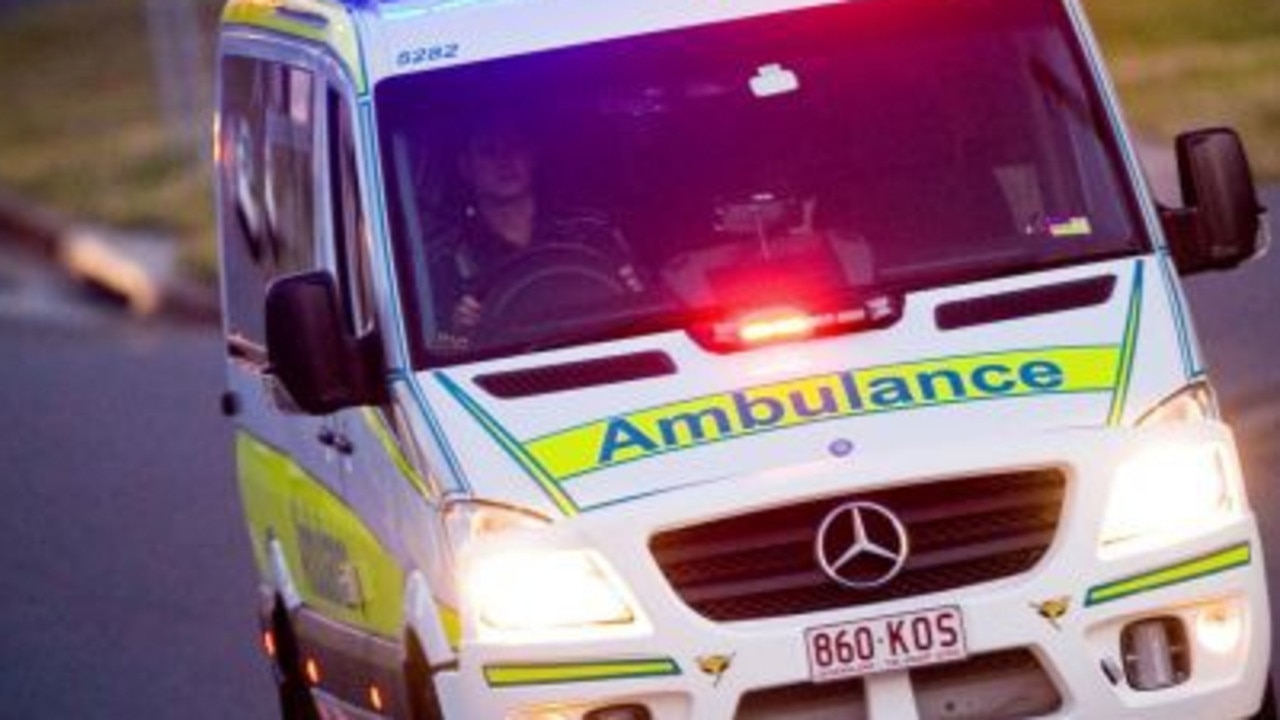 Vehicle on its roof after rollover on busy road