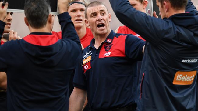 Simon Goodwin talks to his players.