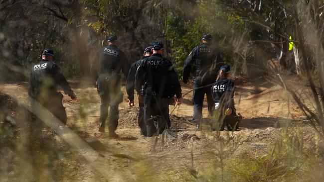 Officers continue to search the crime scene for clues. Picture:Justin Lloyd