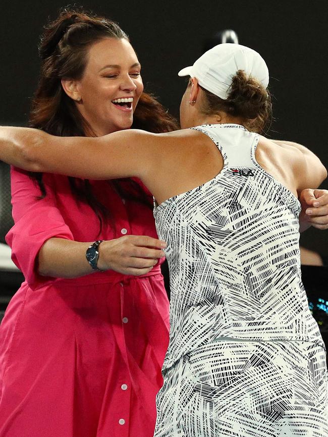 Ash Barty embraces Casey Dellacqua (L). Picture: Aaron Francis/AFP