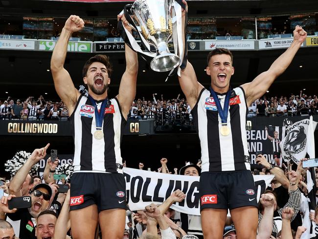 MELBOURNE , AUSTRALIA. September 30, 2023. AFL Grand Final between Collingwood and the Brisbane Lions at the MCG.  Josh Daicos and Nick Daicos of the Magpies with the cup celebrating   .Picture by Michael Klein