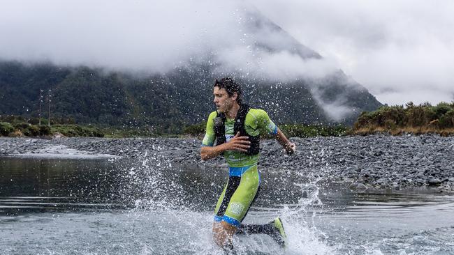 Tasmanian Alex Hunt at the first river crossing of the mountain run in the gruelling 243km Kathmandu Coast to Coast in New Zealand. Picture: Iain McGregor/Coast to Coast