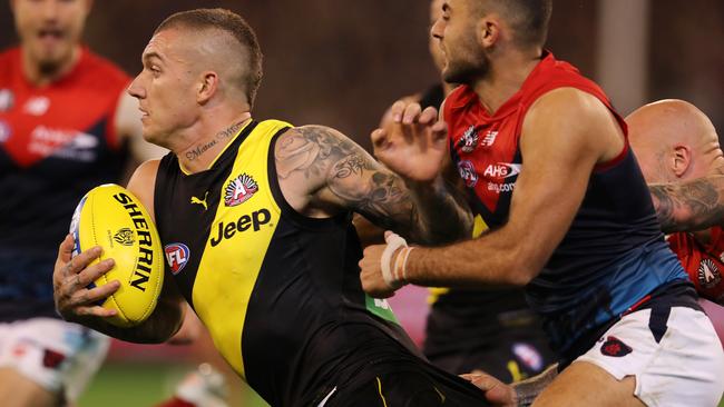 Dustin Martin tries to charge his way through Demon tacklers in Round 5. Picture: Michael Klein