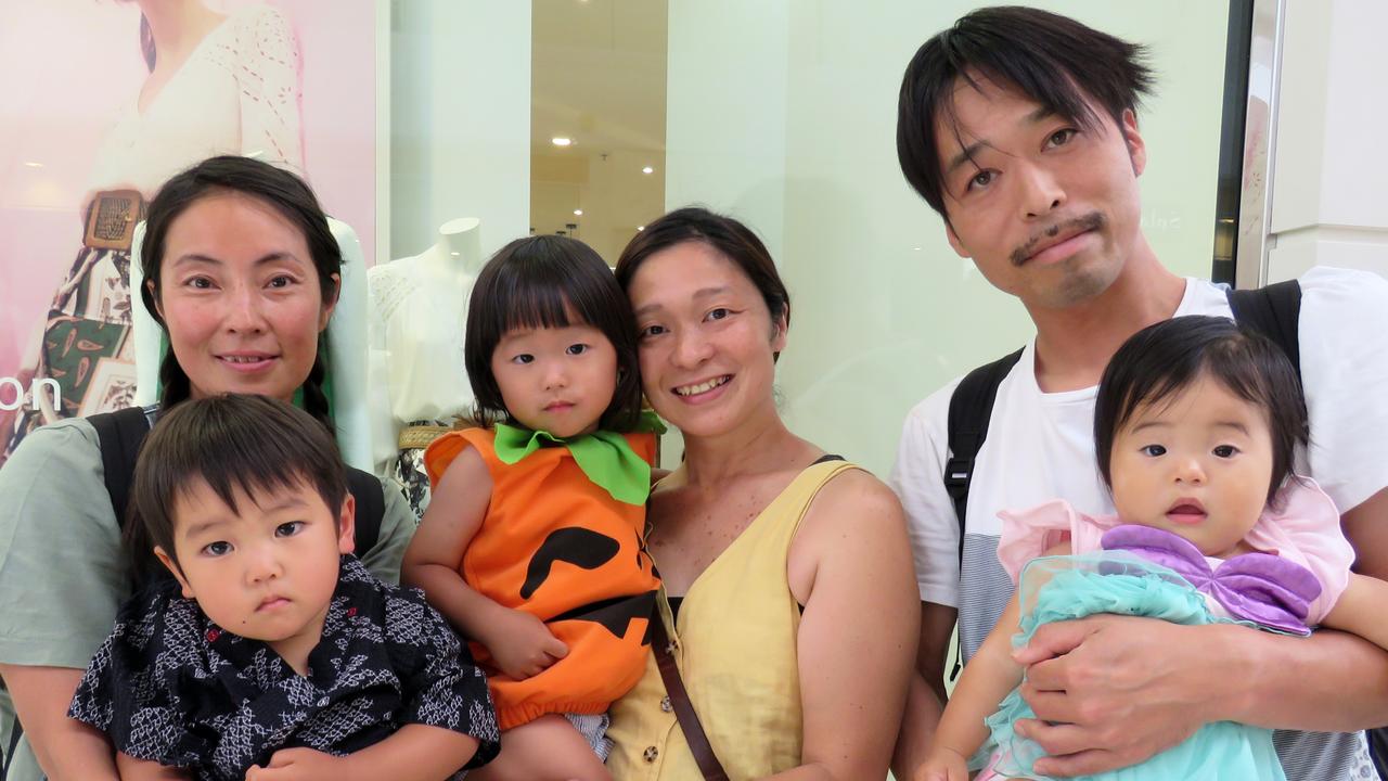 Waiting to go trick-or-treating is Makiko and Yorito Okubo, Rieko and Haku Kanno and Seiji and Minami Ota.