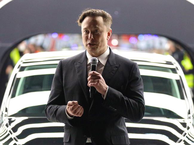 GRUENHEIDE, GERMANY - MARCH 22: Tesla CEO Elon Musk speaks during the official opening of the new Tesla electric car manufacturing plant on March 22, 2022 near Gruenheide, Germany. The new plant, officially called the Gigafactory Berlin-Brandenburg, is producing the Model Y as well as electric car batteries. (Photo by Christian Marquardt - Pool/Getty Images)