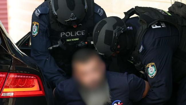 Police arrest a man in Merrylands. Picture: NSW Police Force