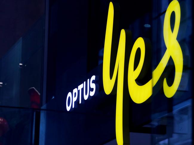 SYDNEY, AUSTRALIA - NOVEMBER 21: The Optus company sign and logo are displayed in a store window in the CBD on November 21, 2023 in Sydney, Australia. Optus' CEO Kelly Bayer Rosmarin stepped down on Monday after an extended outage last week caused millions of Australians to be disconnected from the network, with no access to emergency numbers for hours. The outage followed a hack that saw millions of customers' data shared online last year. (Photo by Lisa Maree Williams/Getty Images)