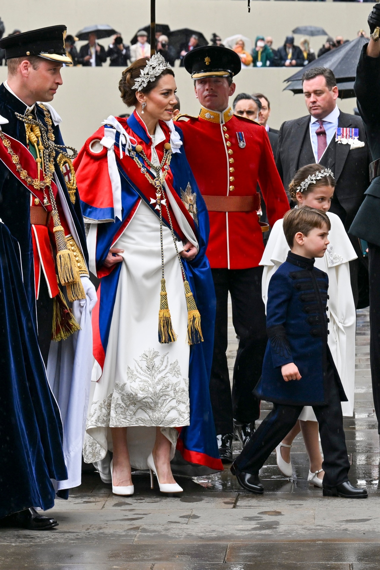 <h2>Kate’s jewellery</h2><p>With her brown hair swept up in a chignon, Kate was able to put her pearl-and-diamond earrings on full display: a precious pair of drops that once belonged to Princess Diana. All royals wear jewellery from the crown’s collection of heirlooms, also called the royal vault. In this, Kate is no different. However, she often chooses to sport jewellery passed down from her most direct predecessors or relatives, specifically Diana and the late Queen Elizabeth II, her grandmother-in-law. Elizabeth, therefore, was present today in Kate’s necklace: the three-strand diamond George VI Festoon Necklace, commissioned in 1950 by King George VI for a then-Princess Elizabeth, and worn by the Queen throughout the entirety of her reign. </p>