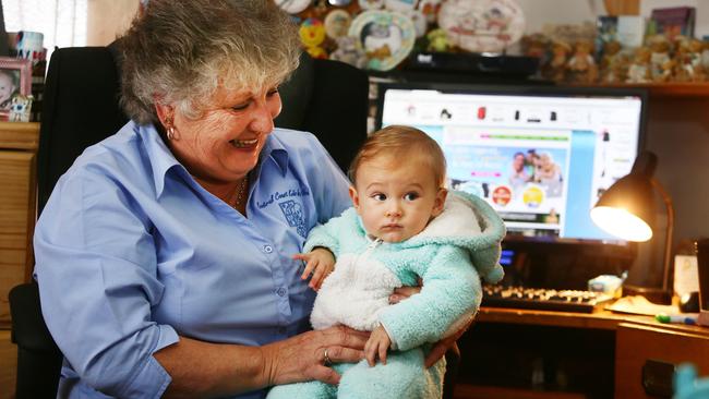 Rhonda Doyle, treasurer, Central Coast Kids in Need, looks after her grandson Stacy Doyle, 7 months, working from home for DoSomething Day. Picture: Peter Clark