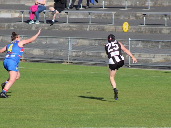 Claremont's Natalie Curtis gets a kick away in the match up against Huonville in the SFLW Community League. Picture: Jake Garland