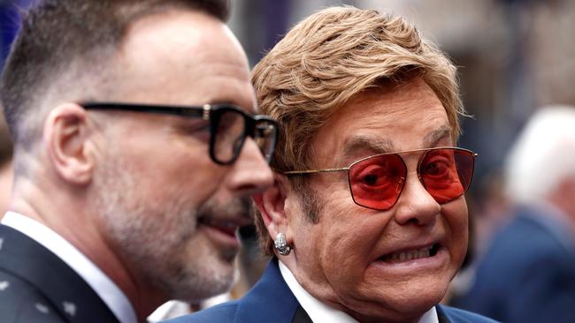 English singer-songwriter Elton John, right, and his husband Canadian producer David Furnish pose on the red carpet upon arriving for the UK premiere of the film Rocketman in London on May 20, 2019. Picture: Adrian Dennis/AFP