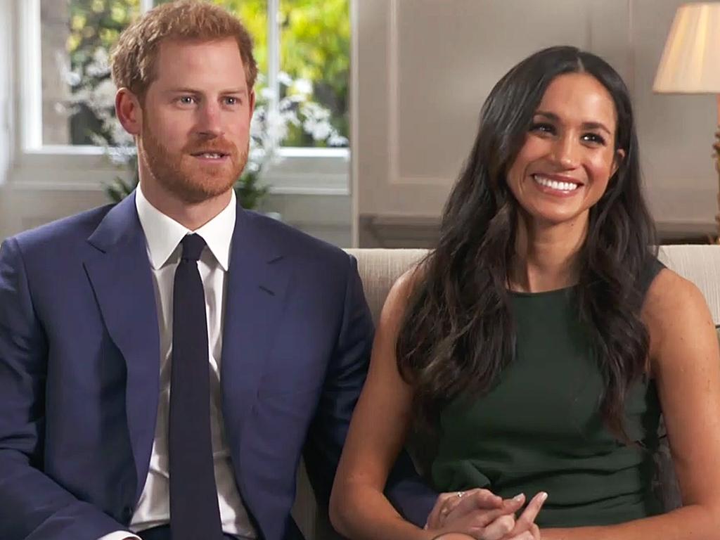 Harry and Meghan (wearing the same P.A.R.O.S.H dress) pictured during their interview after announcing their engagement on November 27, 2017.