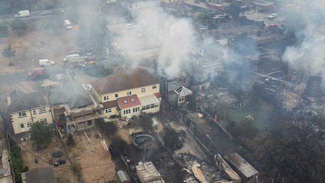 Smoke from fires in a residential area in Wennington, England are seen during the nation’s record-breaking heatwave. Picture: Getty Images