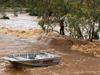 Man rescued as rain turns outback into lake