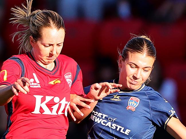 ADELAIDE, AUSTRALIA - MARCH 29: Dylan Holmes  of Adelaide United and Claudia Cicco of the Newcastle Jets during the A-League Women round 22 match between Adelaide United and Newcastle Jets at Coopers Stadium, on March 29, 2024, in Adelaide, Australia. (Photo by Sarah Reed/Getty Images)