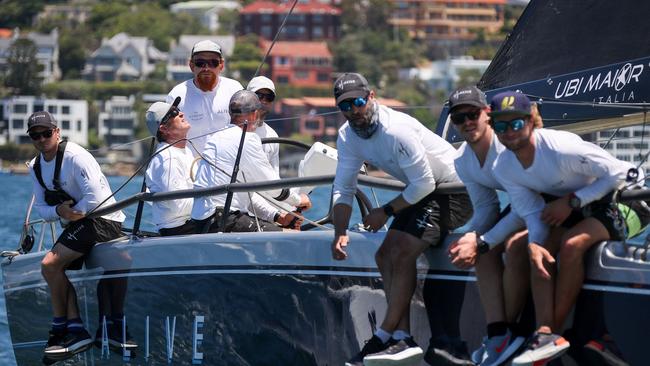 Crew aboard the yacht Alive racing on Sydney Harbour last year.