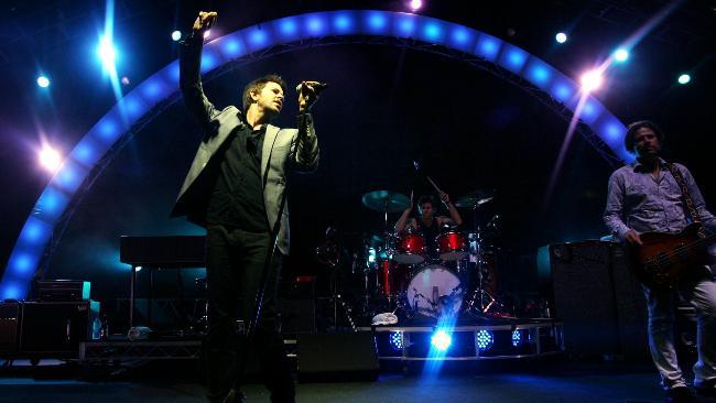 Bernard Fanning belts out a number as Powderfinger performs at Brisbane's Riverstage. Picture: Nathan Richter