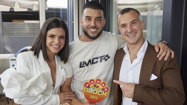 Adrian Portelli (middle) with 2023 The Block contestants Steph and Gian. Picture: Channel 9