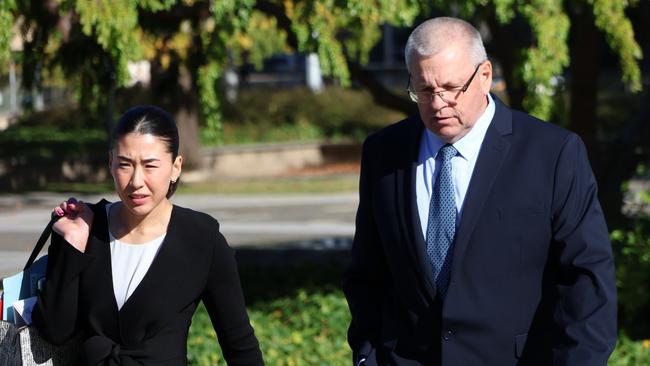 David Brooke, right, arrives at the ACT Magistrates Court with solicitor Satomi Hamon on Tuesday. Picture: Blake Foden